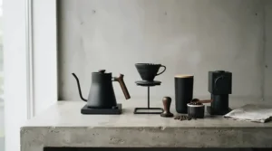 A minimalist black tamping station with knock box blending seamlessly into a contemporary kitchen aesthetic.